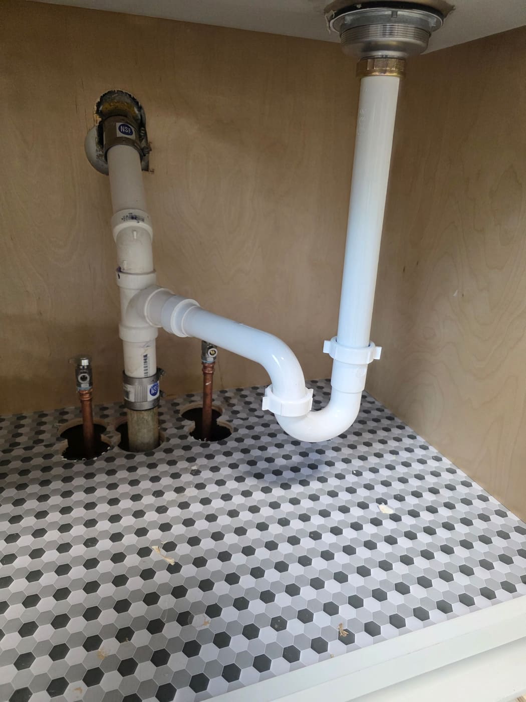 Clean under-sink P-trap installed by Panther Plumbing
